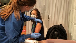 A teacher in Waterbury gets a coronavirus vaccine