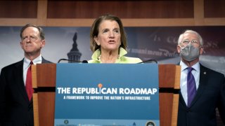 In this April 22, 2021, file photo, Sen. Shelley Moore Capito, a Republican from West Virginia, center, speaks as Sen. Pat Toomey, a Republican from Pennsylvania, left, and Sen. Roger Wicker, a Republican from Mississippi, right, listen during a news conference on Capitol Hill in Washington, D.C.