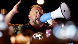 Radio host Alex Jones rallies pro Trump supporters outside the Maricopa County Recorder's Office, in Phoenix, Nov. 5, 2020.