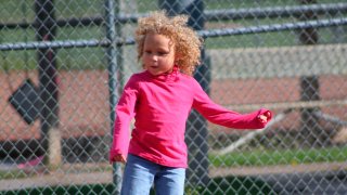 Jurnee Hoffmeyer, 7, seen here before a classmate and a teacher cut her hair on separate occasions.