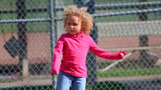 Jurnee Hoffmeyer, 7, seen here before a classmate and a teacher cut her hair on separate occasions.