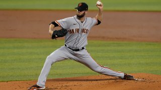 San Francisco starting pitcher Alex Wood throws a pitch during the first inning of a baseball game against the Miami Marlins, Sunday, April 18, 2021, in Miami.