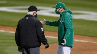 Oakland Athletics manager Bob Malvin talks to umpire Brian Gorman.