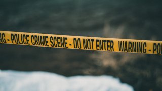 Police crime scene with a yellow 'caution' tape