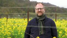 Vintner Dan Petrosky of Larkmead Winery stands in a research plot.