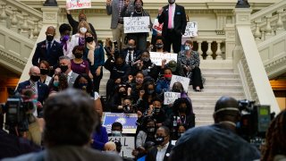 Demonstrators hold a sit-in inside of the Capitol building in opposition of House Bill 531 on March 8, 2021 in Atlanta, Georgia. HB531 will restrict early voting hours, remove drop boxes, and require the use of a government ID when voting by mail.
