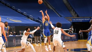 SAN FRANCISCO, CA – APRIL 12: Stephen Curry #30 of the Golden State Warriors shoots a three point basket during the game against the Denver Nuggets on April 12, 2021 at Chase Center in San Francisco, California. NOTE TO USER: User expressly acknowledges and agrees that, by downloading and or using this photograph, user is consenting to the terms and conditions of Getty Images License Agreement. Mandatory Copyright Notice: Copyright 2021 NBAE (Photo by Noah Graham/NBAE via Getty Images)