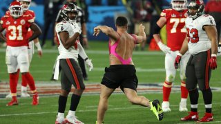 TAMPA, FLORIDA - FEBRUARY 07: Yuri Andrade trespasses on the field during the fourth quarter in Super Bowl LV between the Tampa Bay Buccaneers and the Kansas City Chiefs at Raymond James Stadium on February 07, 2021 in Tampa, Florida.
