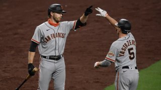 Mike Yastrzemski of the San Francisco Giants is congratulated by Austin Slater.