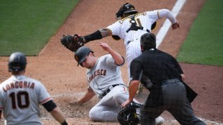 Alex Dickerson of the San Francisco Giants scores.