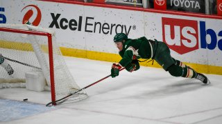 Minnesota Wild center Nico Sturm makes a wraparound shot for goal against the San Jose Sharks during the second period of an NHL hockey game Saturday, April 17, 2021, in St. Paul, Minnesota.