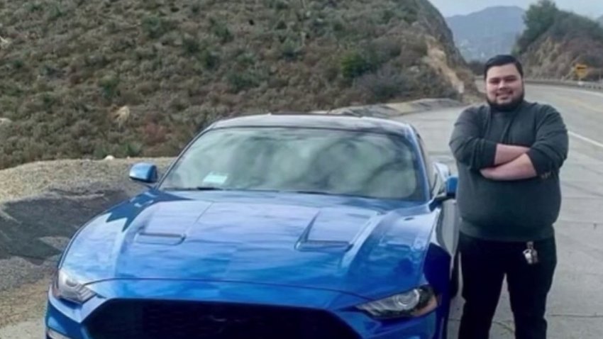 Alexis Carbajal is pictured with his blue Mustang.