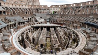 few visitors arrive for their tour of the ancient Colosseum, in Rome