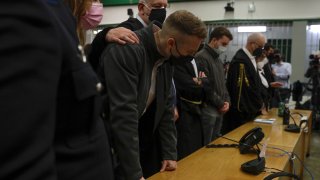 Finnegan Lee Elder, foreground, listens as the verdict is read, in the trial for the slaying of an Italian plainclothes police officer on a street near the hotel where he and his co-defendant Gabriel Natale-Hjorth were staying while on vacation in Rome in summer 2019, in Rome, Wednesday, May 5, 2021.