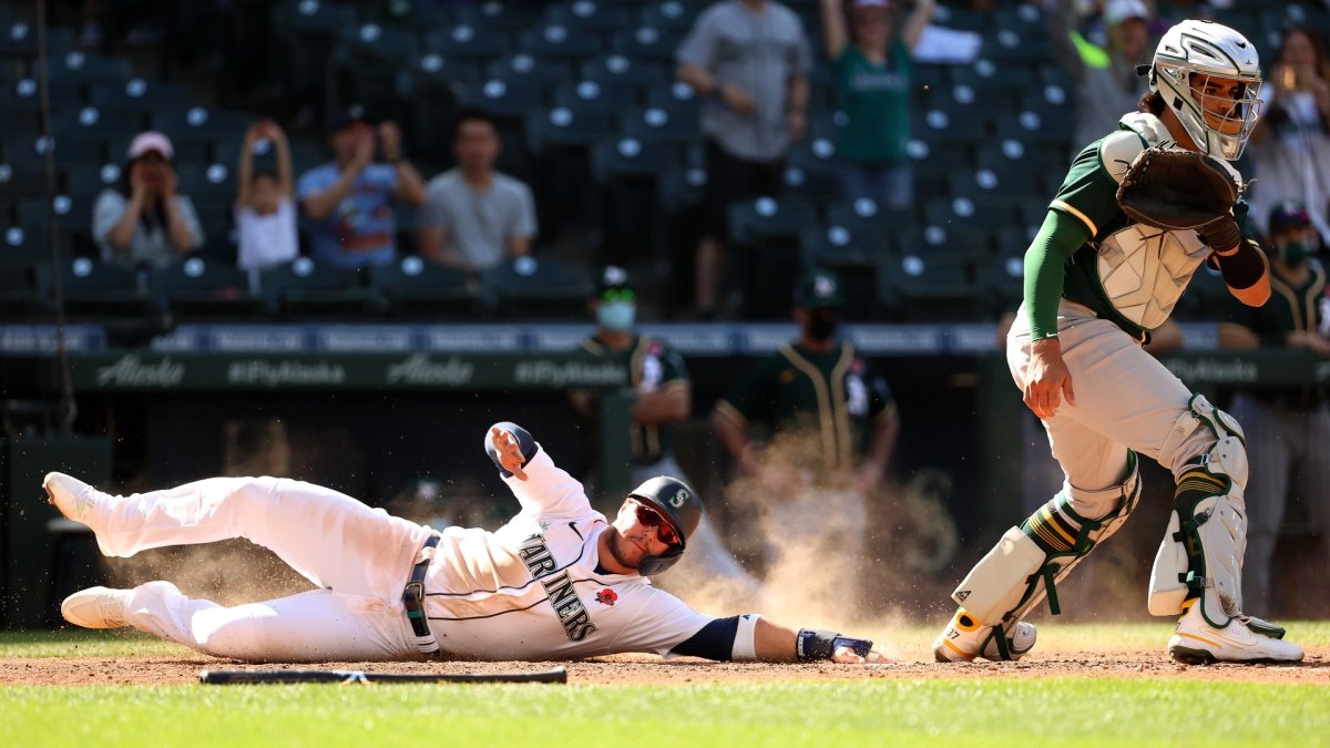 Mariners rally late, post five-run 10th to sink Athletics