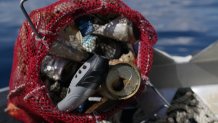 A mesh bag filled with trash and other debris found in Lake Tahoe.