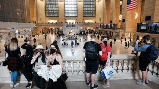 People walk through Grand Central Terminal in Manhattan on May 04, 2021 in New York City.