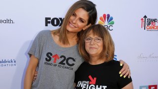 In this Sept. 7, 2018, file photo, Maria Menounos, left, and her mother Litsa Menounos arrive at the 2018 Stand Up To Cancer event at the Barker Hangar at the Santa Monica airport in Santa Monica, California.