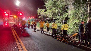 Authorities at the scene of a fire and crash near the Saratoga Gap Preserve.