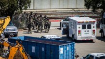 SAN JOSE, CA - MAY 26: Tactical law enforcement officers move through the Valley Transportation Authority (VTA) light-rail yard where a mass shooting occurred on May 26, 2021 in San Jose, California. A VTA employee opened fire at the yard, with preliminary reports indicating nine people dead including the gunman. (Photo by Philip Pacheco/Getty Images)