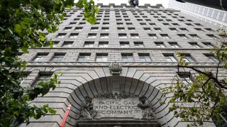 Signage is displayed outside PG&E headquarters in San Francisco, California, U.S., on Monday, July 20, 2020. (Photographer: David Paul Morris/Bloomberg via Getty Images)