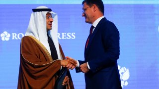 Minister of Energy of Russia, Alexander Novak (R) shakes hands with Saudi Arabia’s Energy Minister, Prince Abdulaziz bin Salman (L) at the end of the plenary session titled ”Maintaining Energy Connectivity in an Unstable World” as part of the Russian Energy Week 2019 International Forum at the Manege Central Exhibition Hall in Moscow, Russia on October 03, 2019.