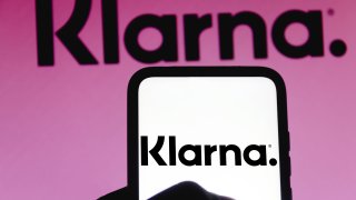 The Klarna logo displayed on a smartphone.