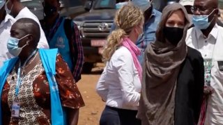 In this image taken from video, Special Envoy to the United Nations High Commissioner for Refugees Angelie Jolie, right, visits the Malian refugee camp in Goudebo, Burkina Faso, Sunday June 20, 2021, to mark World Refugee day on Sunday. Hollywood actress Angelina Jolie has visited war-weakened Burkina Faso to show solidarity with people who continue to welcome the displaced, despite grappling with their own insecurity, and said the world isn’t doing enough to help.