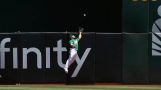 Ramon Laureano #22 of the Oakland Athletics catches a fly ball.
