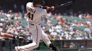 Wilmer Flores #41 of the San Francisco Giants hits a single against the Philadelphia Phillies in the bottom of the third inning at Oracle Park on June 20, 2021 in San Francisco, California.