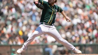 Cole Irvin #19 of the Oakland Athletics pitches against the San Francisco Giants in the bottom of the first inning at Oracle Park on June 27, 2021 in San Francisco, California.