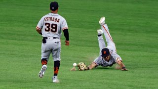 LaMonte Wade Jr #31 of the San Francisco Giants dives for a ball.