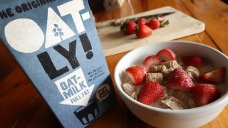 In this photo illustration Oatly oat milk is shown on May 20, 2021 in Chicago, Illinois.