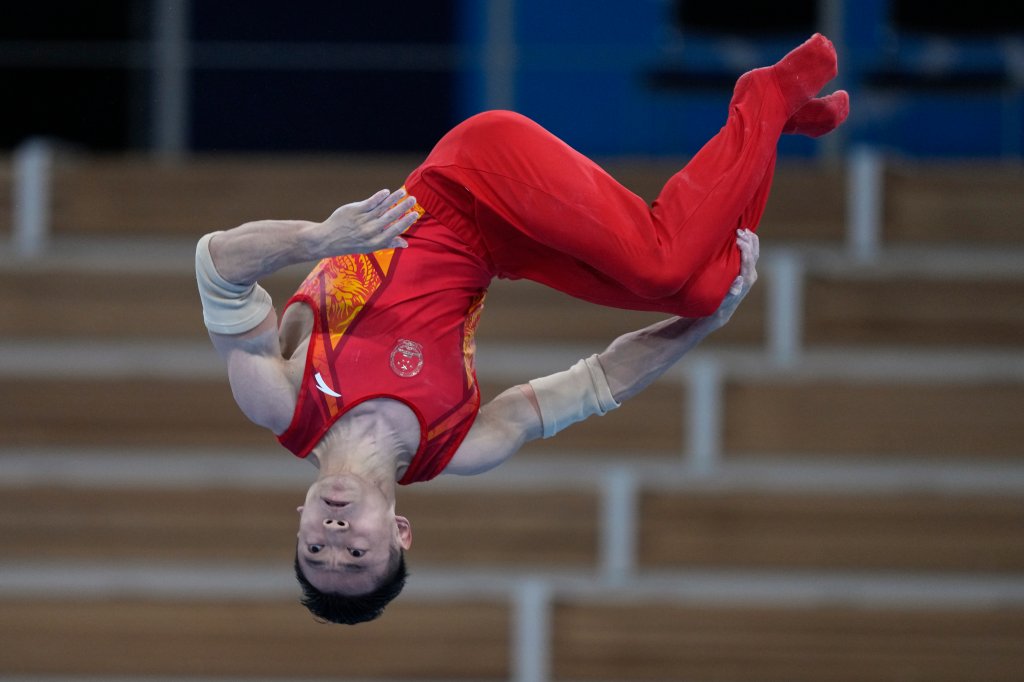 China's Zou Jingyuan performs on the parallel bars