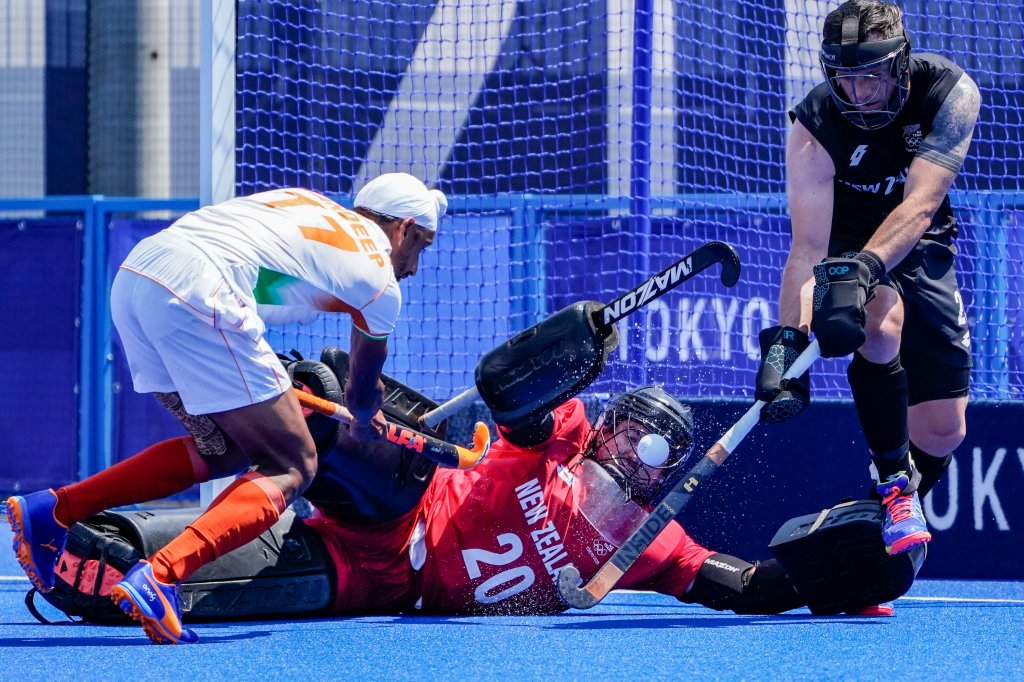 India midfielder Sumit (17) takes a shot on New Zealand goalkeeper Leon Hayward (20) during a men's field hockey match at the 2020 Summer Olympics, Saturday, July 24, 2021, in Tokyo, Japan.