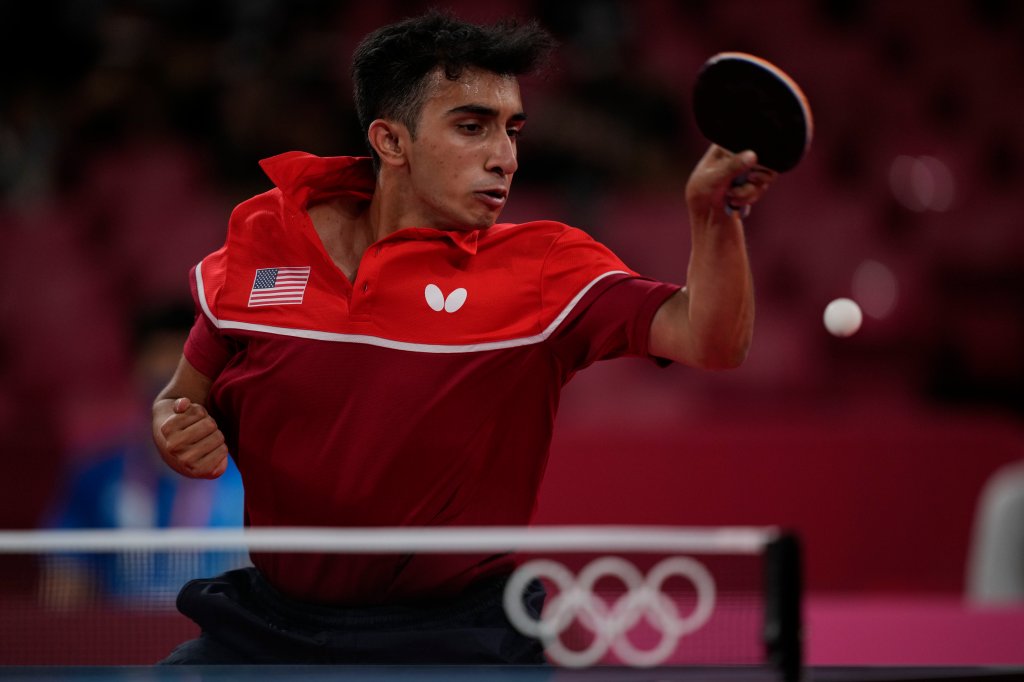 Nikhil Kumar, of United State competes during men's table tennis singles preliminary round match against Mongolia's Enkhbat Lkhagvasuren at the 2020 Summer Olympics, Saturday, July 24, 2021, in Tokyo.