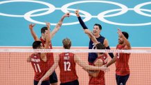 United States' team players celebrate a point during a men's volleyball preliminary round pool B match between United States and Tunisia at the 2020 Summer Olympics, Wednesday, July 28, 2021, in Tokyo, Japan.