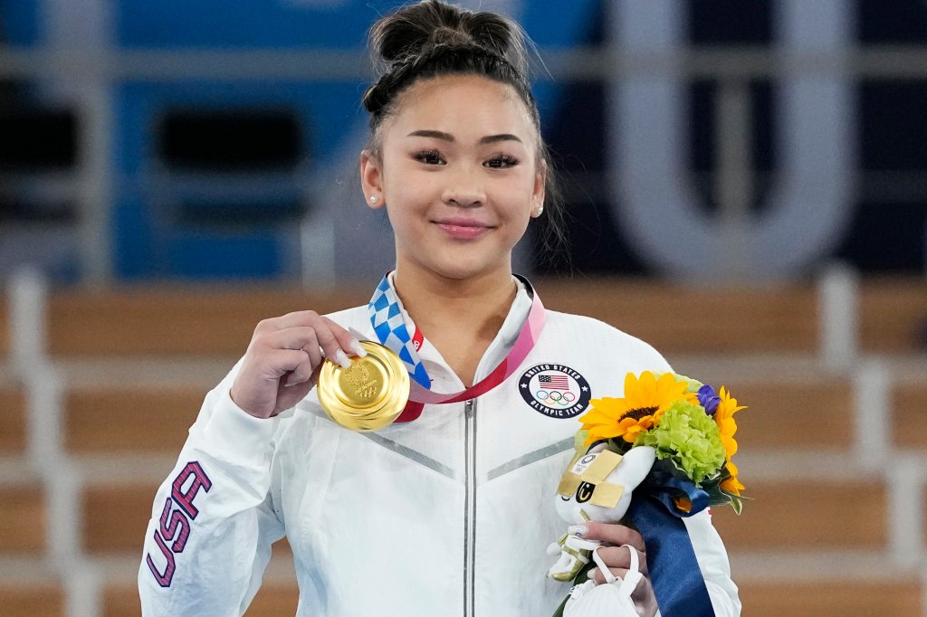 Gold medallist Sunisa Lee of the Unites States displays her medal for the artistic gymnastics women's all-around at the 2020 Summer Olympics, Thursday, July 29, 2021, in Tokyo. Lee took home gold for the United States for the fifth year running in this category.