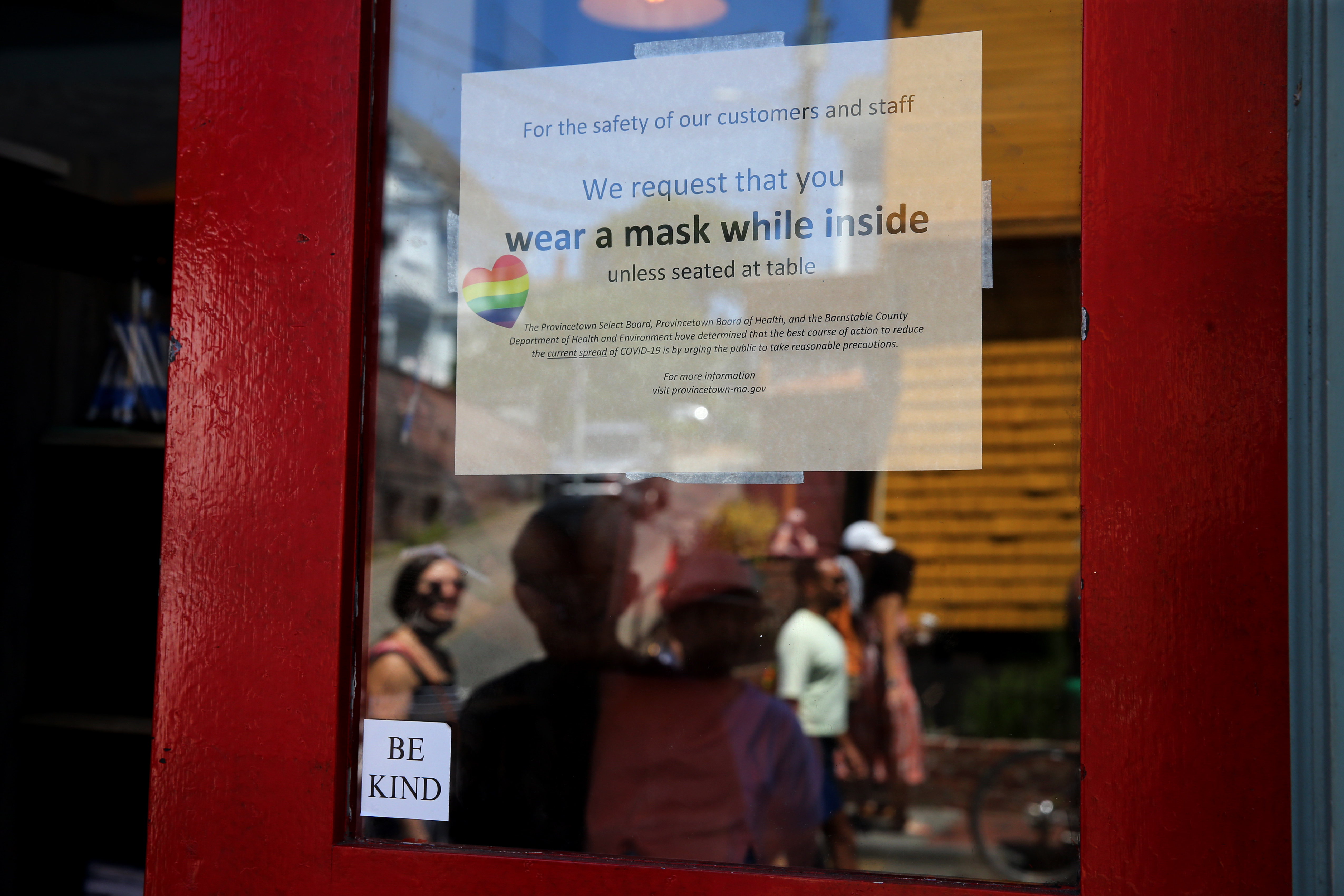 A sign at the Heaven Cafe in Provincetown encourages customers to wear masks until seated, in Provincetown, MA on July 24, 2021. (Photo by Craig F. Walker/The Boston Globe via Getty Images)