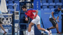 Serbia's Novak Djokovic smashes his racket during his Tokyo 2020 Olympic Games men's singles tennis match for the bronze medal against Spain's Pablo Carreno Busta at the Ariake Tennis Park in Tokyo on July 31, 2021.