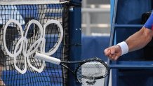 Serbia's Novak Djokovic smashes his racket during his Tokyo 2020 Olympic Games men's singles tennis match for the bronze medal against Spain's Pablo Carreno Busta at the Ariake Tennis Park in Tokyo on July 31, 2021.