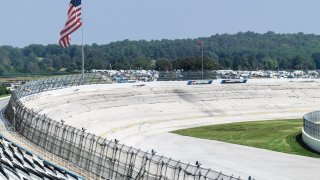This file image shows a general view of an empty race track and American flag.