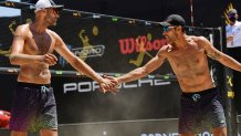 Phil Dalhausser and Nick Lucena celebrate in the finals against Trevor Crabb (not pictured) and Tri Bourne (not pictured) during the Porsche Cup on Aug. 2, 2020, in Long Beach, California.