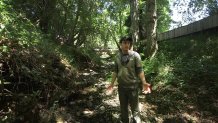 Preston Brown of the group SPAWN stands in dried-up Arroyo Creek near Lagunitas.