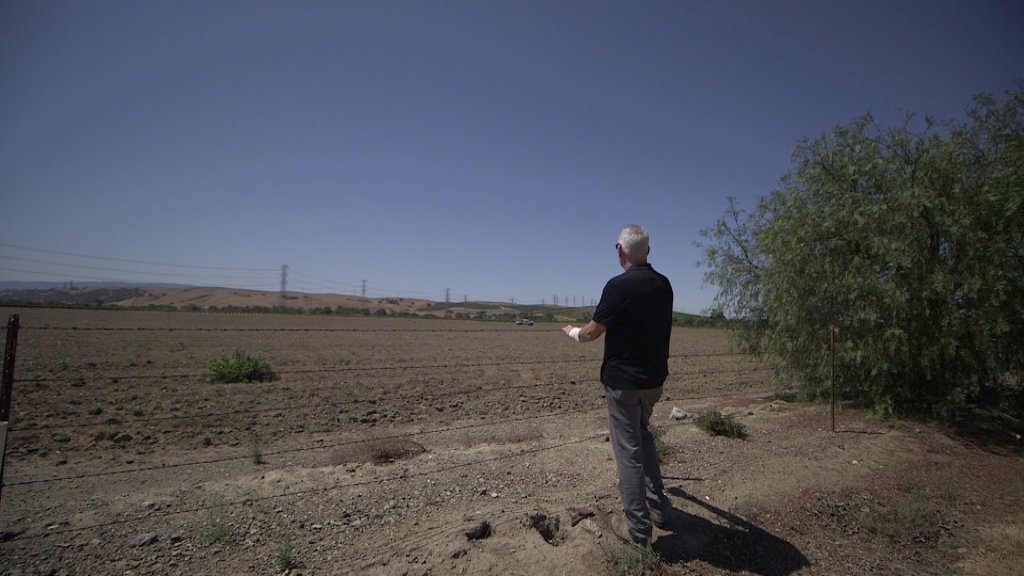Livermore winemaker Steven Mirassou admires a dirt field he believes could be planted with cabernet franc grapes.