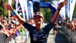 Rach McBride of Canada celebrates a third place finish in the Pro Women's Division during the Subaru Ironman Canada triathlon on July 30, 2017 in Whistler, Canada. 