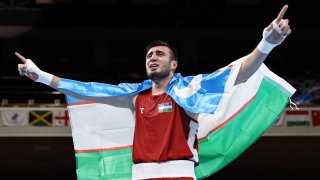 Bakhodir Jalolov of Uzbekistan celebrates his gold medal boxing win in the super heavyweight category at the 2020 Tokyo Olympic Games