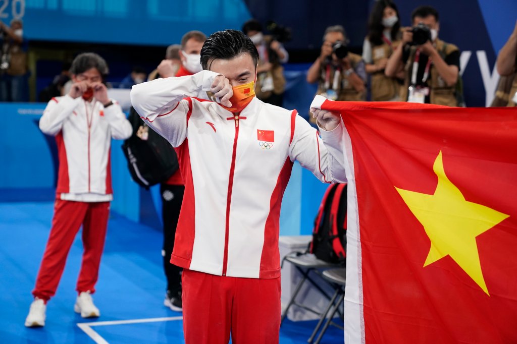 Liu Yang, of China, cries after winning gold