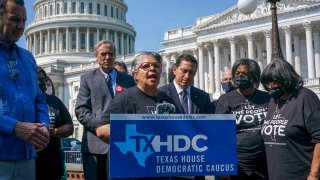Texas state Rep. Senfronia Thompson, dean of the Texas House of Representatives, is joined by Sen. Jeff Merkley, D-Ore., left center, and other Texas Democrats, as they continue their protest of restrictive voting laws, at the Capitol in Washington, Friday, Aug. 6, 2021.