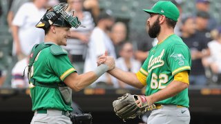 Sean Murphy #12 and Lou Trivino #62 of the Oakland Athletics celebrate